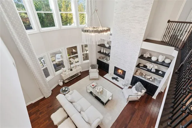 a kitchen with granite countertop stainless steel appliances a sink and cabinets