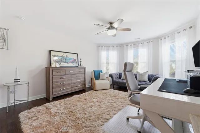 a view of house with a backyard