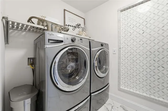 an aerial view of a house with a garden and trees