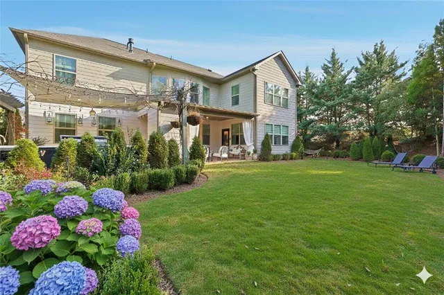 an aerial view of a house with outdoor space