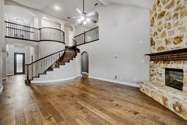 a view of entryway and hall with wooden floor