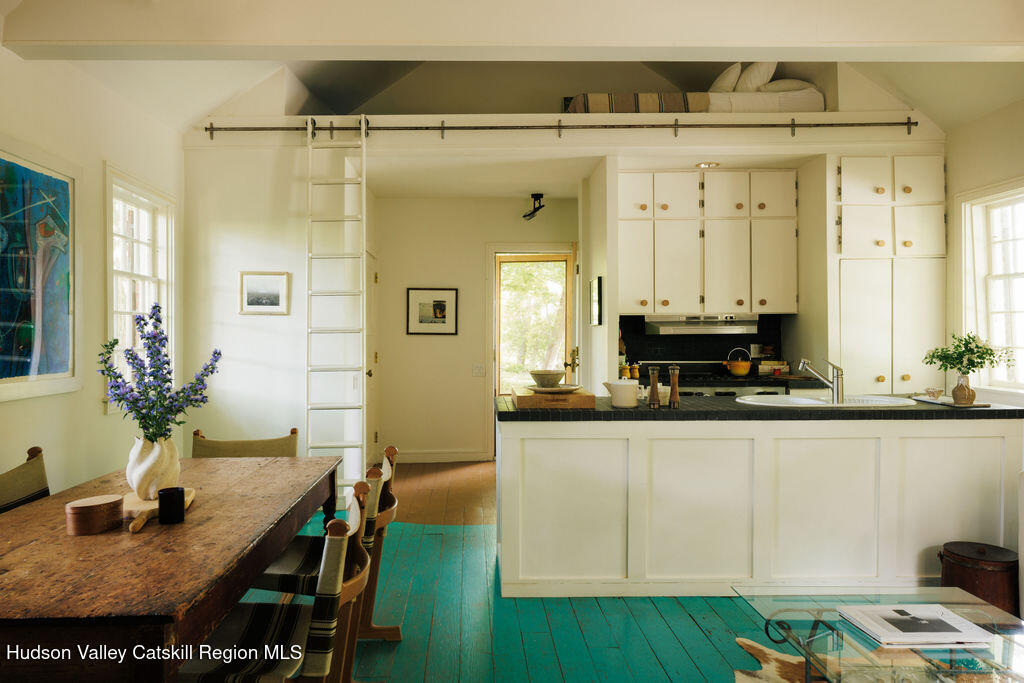 577 Jefferson Hill Road Nassau, NY 12123 - Photo 5 of 33 a kitchen with sink cabinets and dining table