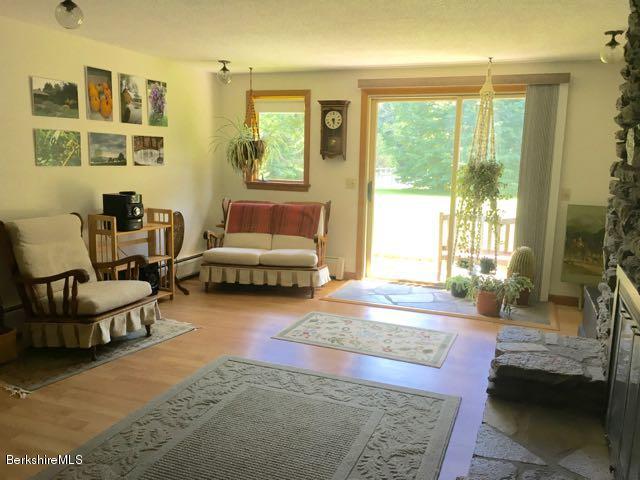 32 Pine Knoll Road Lenox, MA 01240 - Photo 22 of 38 a living room with furniture and a large window