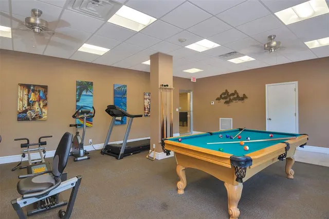 a kitchen with stainless steel appliances granite countertop a sink and a refrigerator