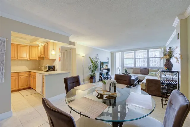 a view of a livingroom with furniture and a window