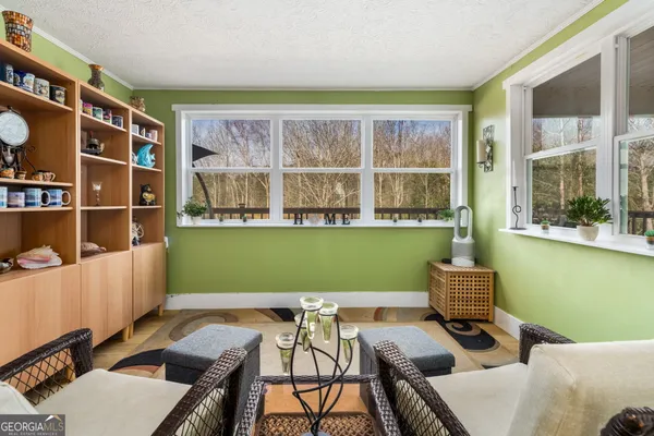 a view of a dining room with furniture window and outside view