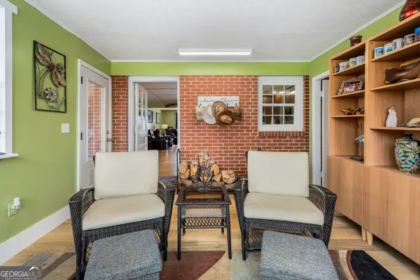 a view of a livingroom with furniture and a window