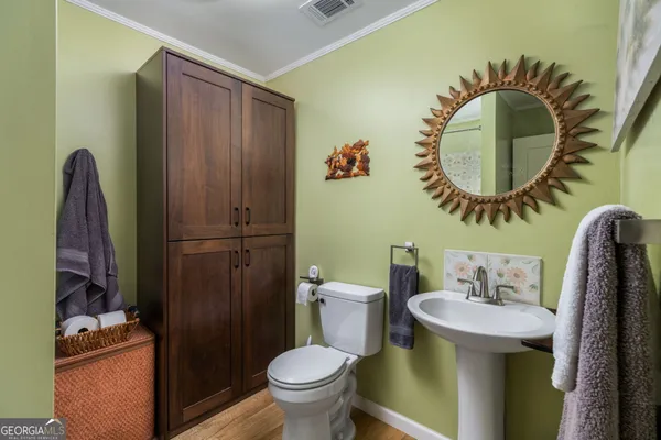a bathroom with a toilet and a sink