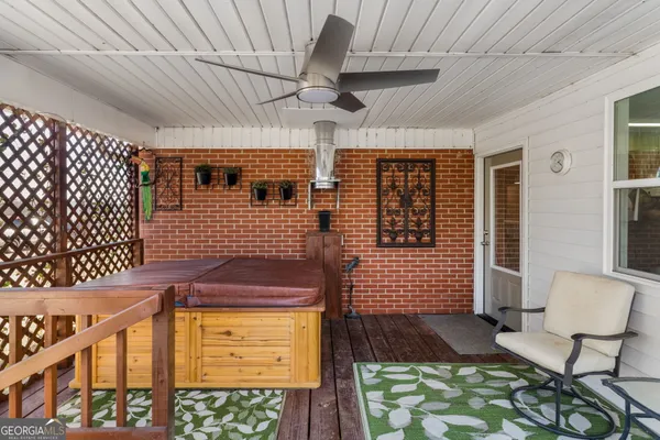 a view of front door of house with outdoor seating