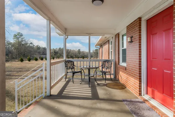 a view of a wooden deck with a yard