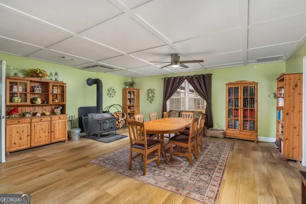 a dining room with furniture and window