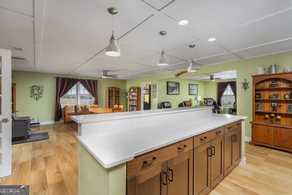 a kitchen with stainless steel appliances granite countertop a sink and a refrigerator