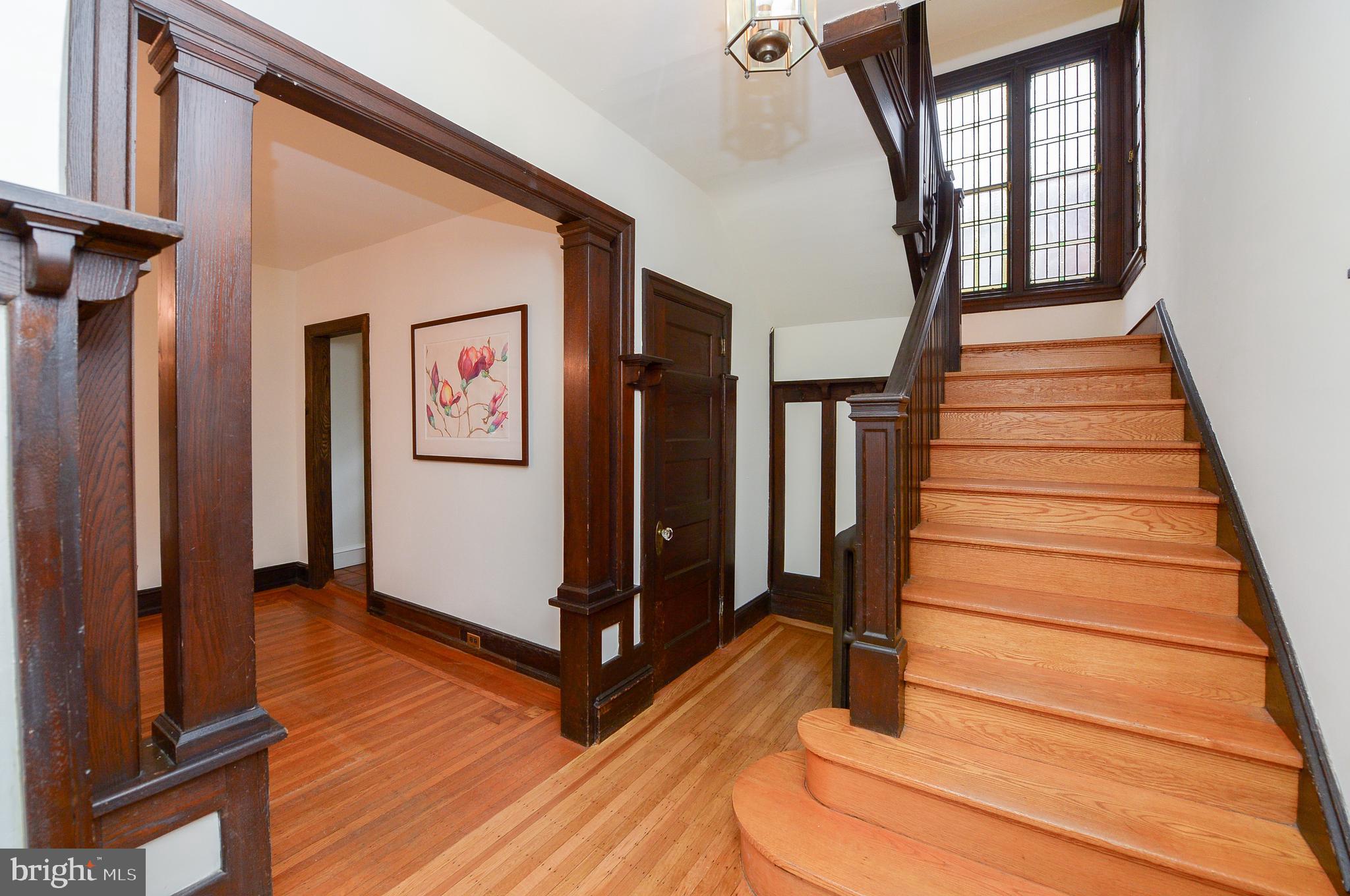7133 Cresheim Road Philadelphia, PA 19119 - Photo 21 of 76 Front foyer looking upstairs to stained glass bay