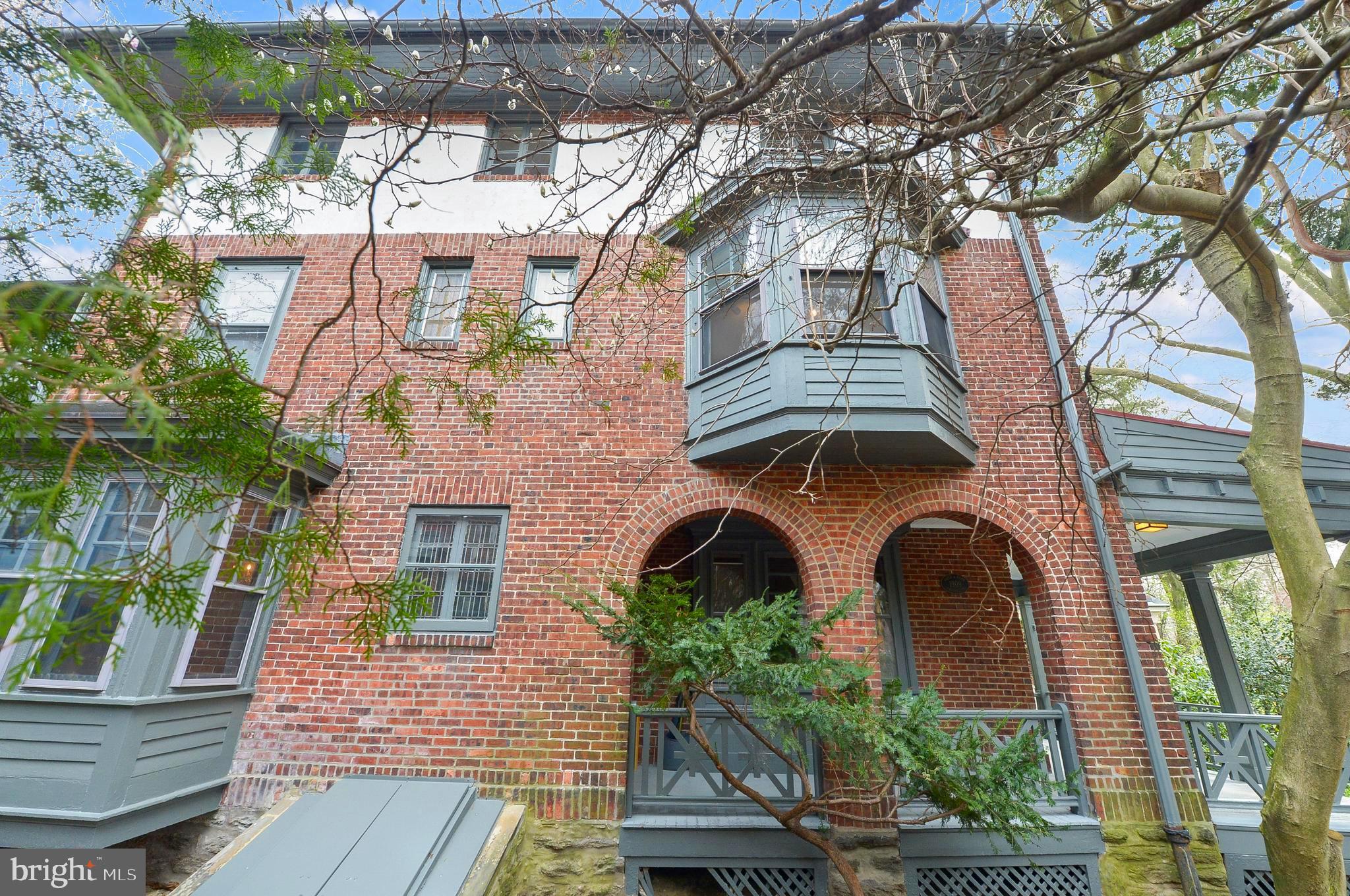 7133 Cresheim Road Philadelphia, PA 19119 - Photo 3 of 76 Left side exterior - Magnolia beginning to bloom