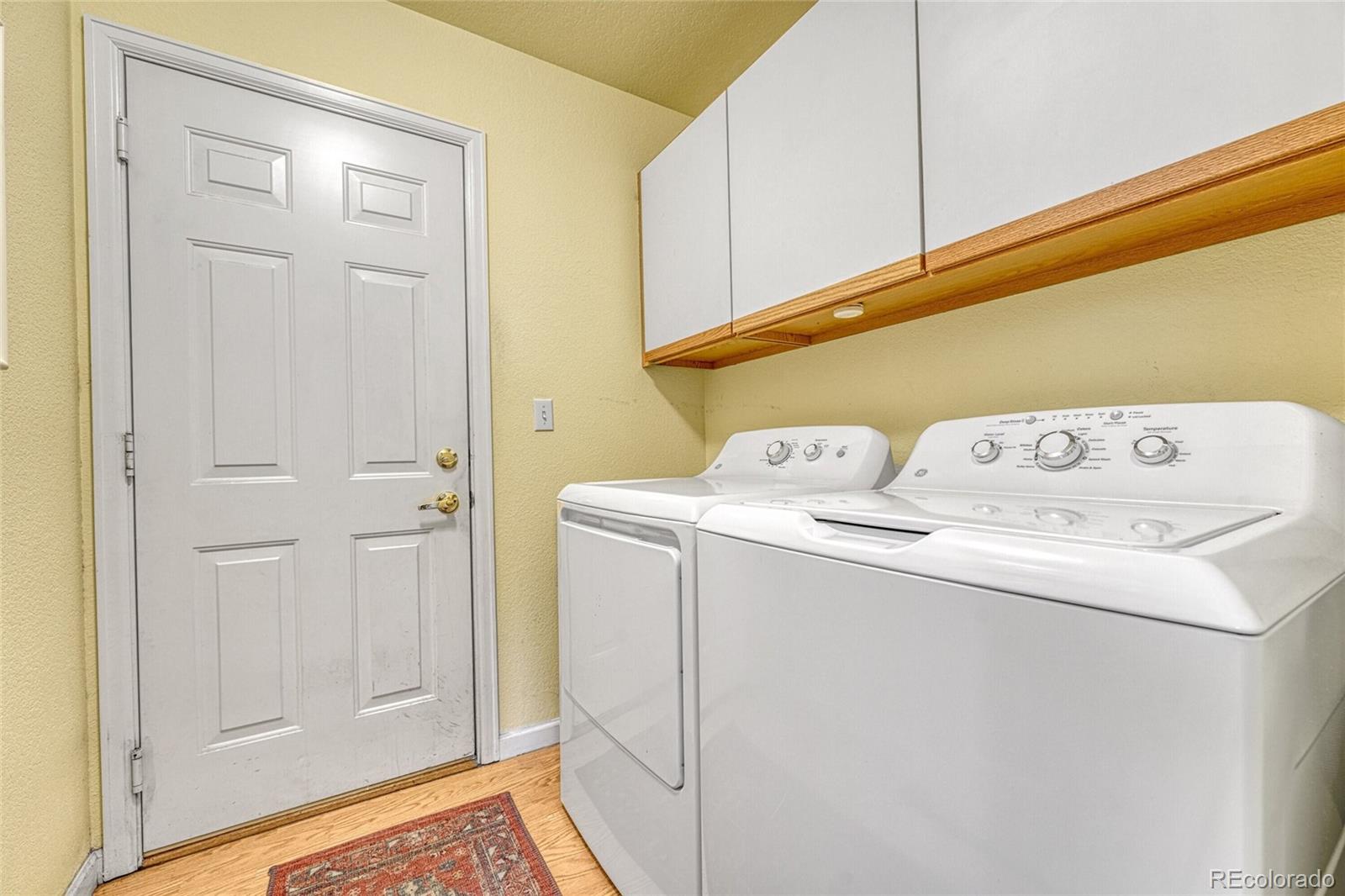 9247 Sugarstone Circle Highlands Ranch, CO 80130 - Photo 17 of 48 a utility room with dryer and washer