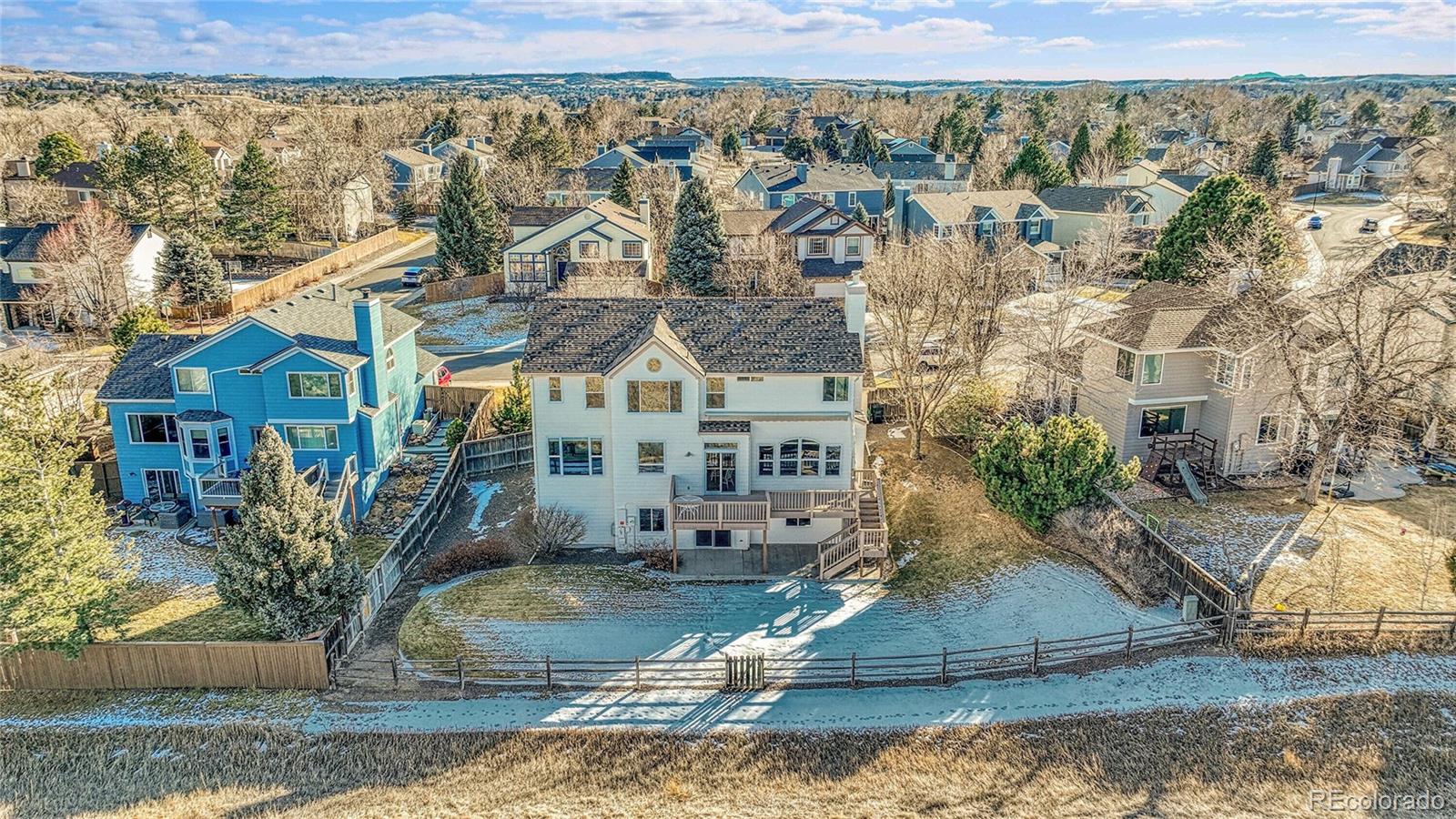 9247 Sugarstone Circle Highlands Ranch, CO 80130 - Photo 39 of 48 a view of a house with a yard and a large tree