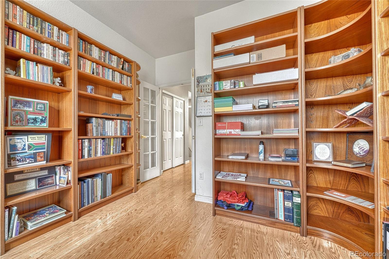 9247 Sugarstone Circle Highlands Ranch, CO 80130 - Photo 7 of 48 a view of a living room and a book shelf