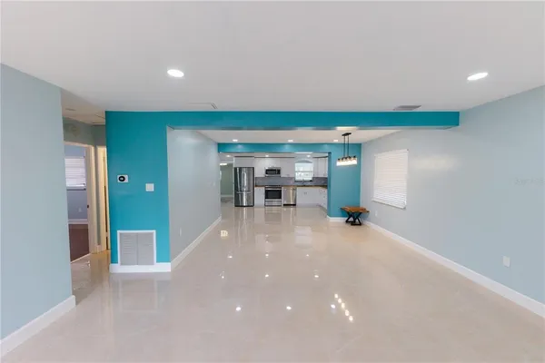 a view of a livingroom with furniture and lots of living room