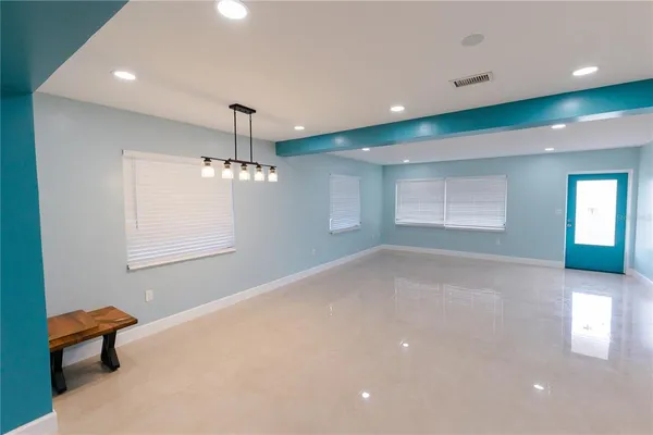 a kitchen with granite countertop a stove and a microwave