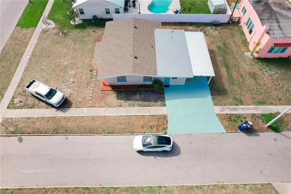 an aerial view of residential houses with outdoor space