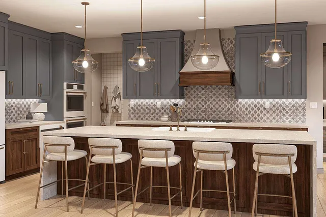 a kitchen with a dining table chairs and white cabinets