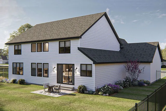 a front view of a house with a garden and plants