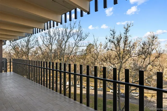 a view of a house with iron fence