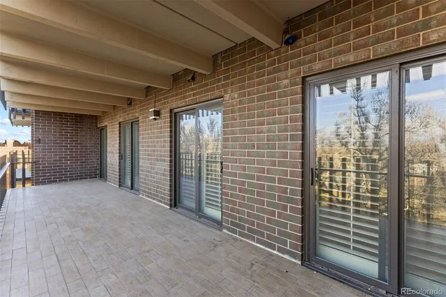 a view of parking garage with cars parked
