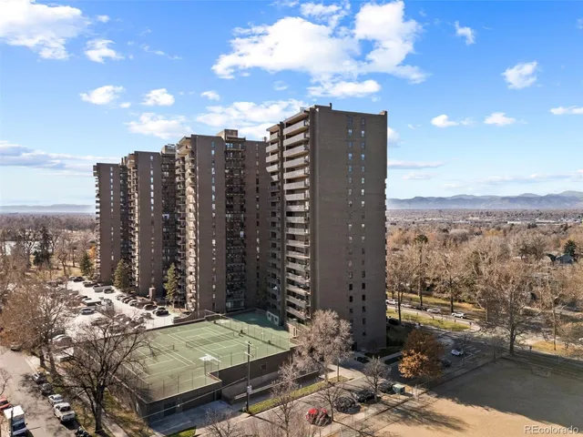 a room with pool table and windows