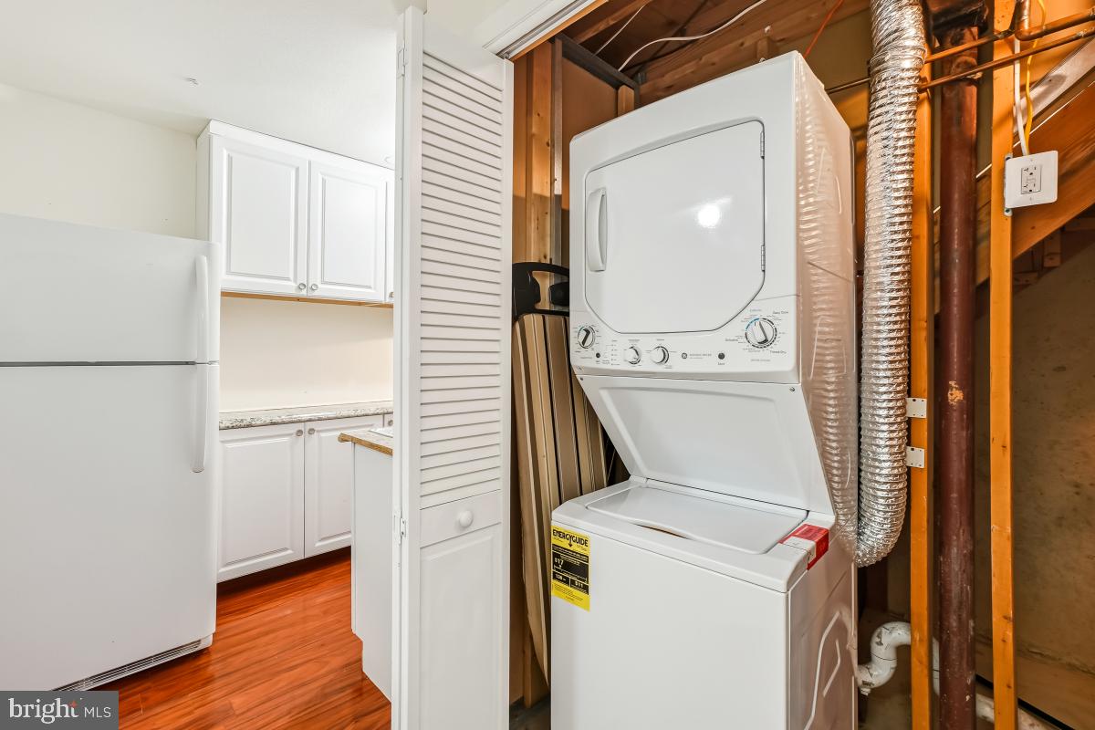 9040 Armendown Drive Springfield, VA 22152 - Photo 23 of 30 a utility room with dryer and washer