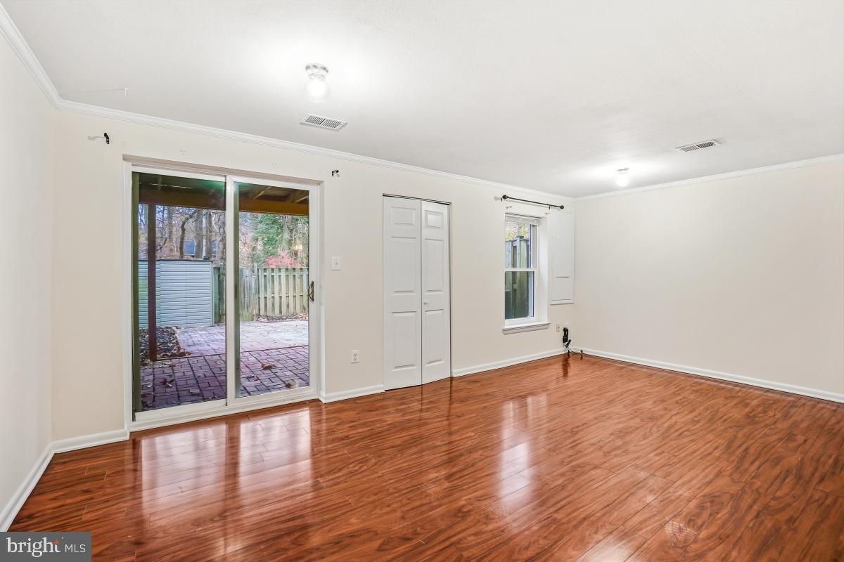 9040 Armendown Drive Springfield, VA 22152 - Photo 27 of 30 wooden floor in an empty room with a window