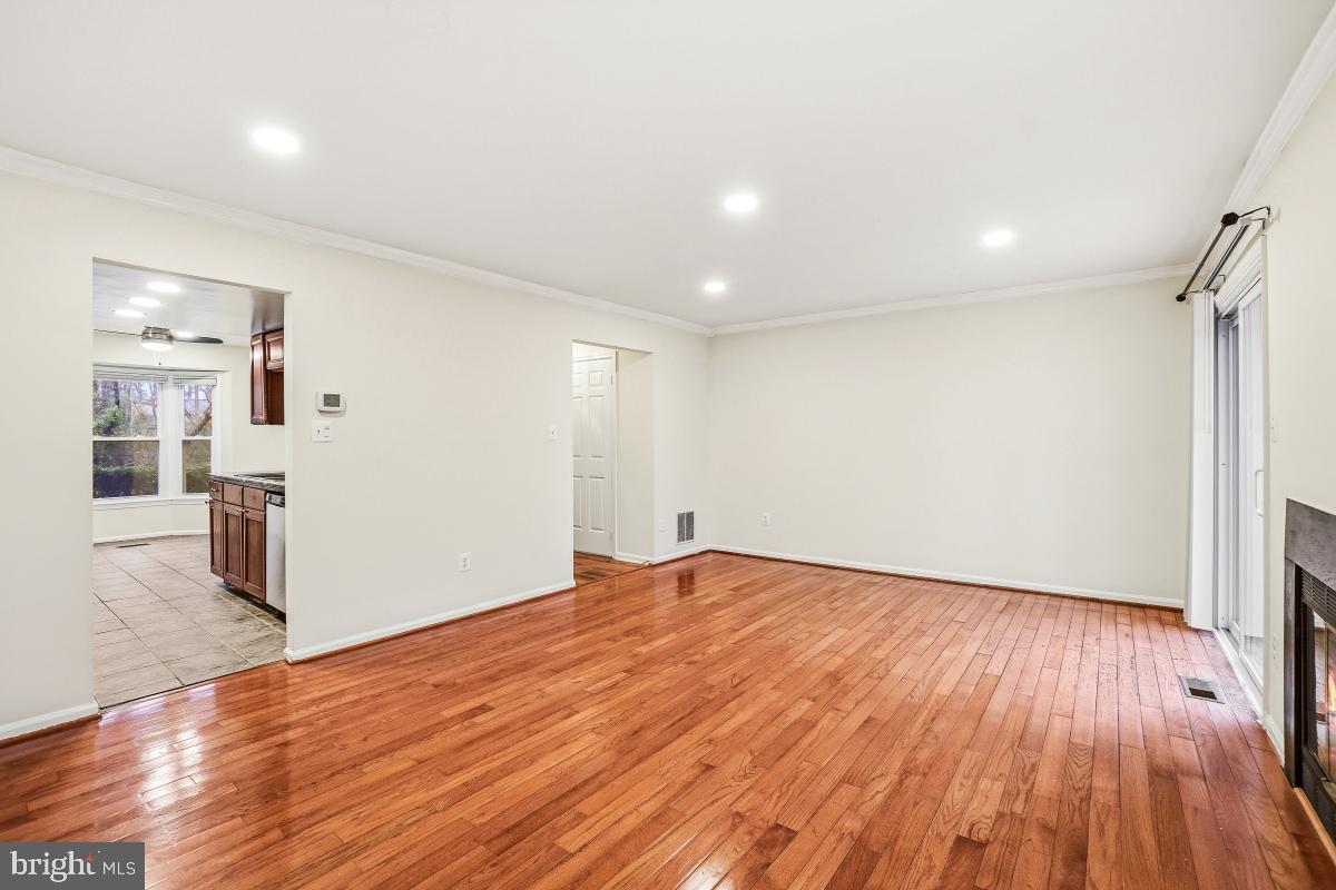9040 Armendown Drive Springfield, VA 22152 - Photo 7 of 30 a view of empty room with wooden floor