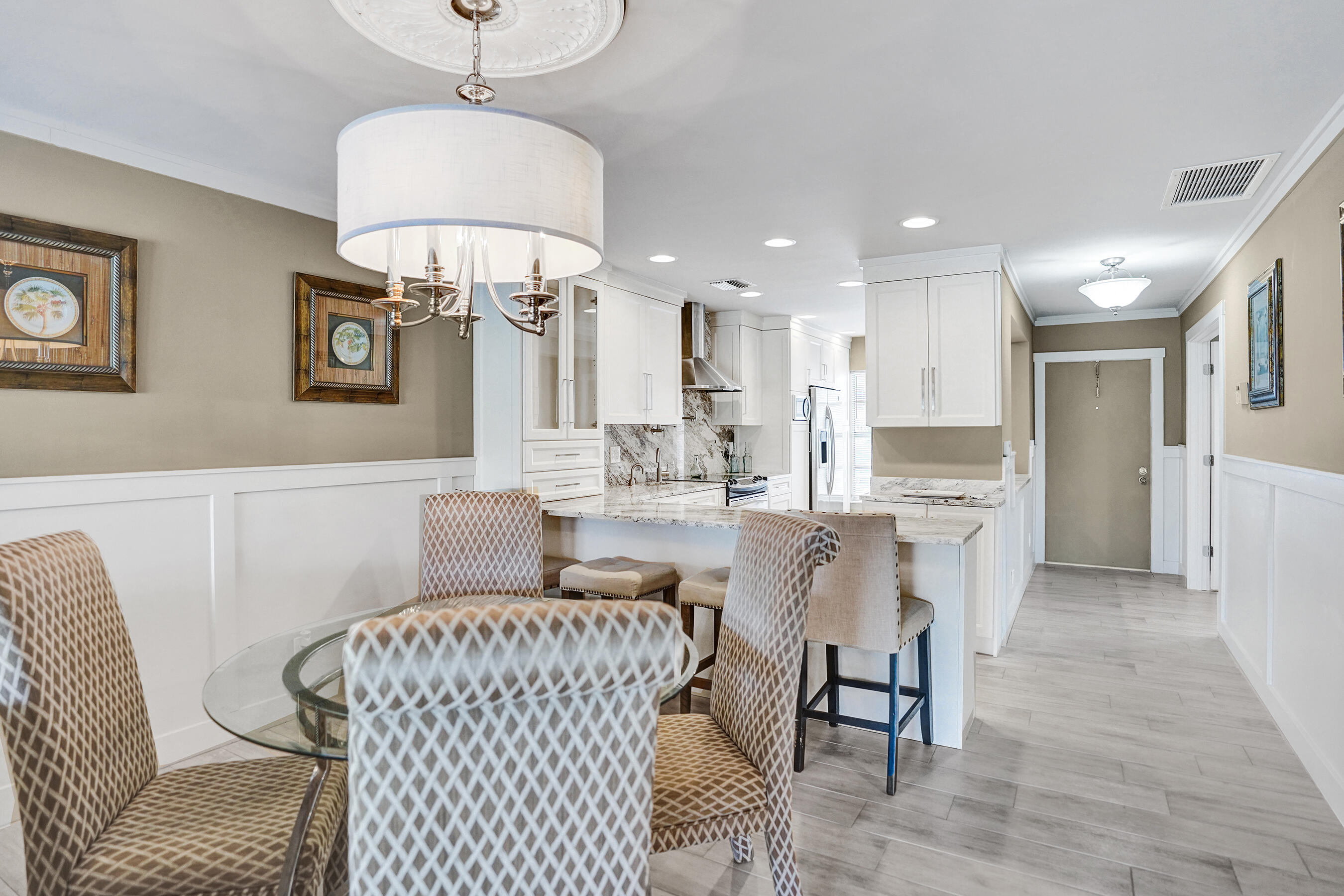 2820 Southwest 13th Street, Unit 101 Delray Beach, FL 33445 - Photo 32 of 83 Dining area to kitchen