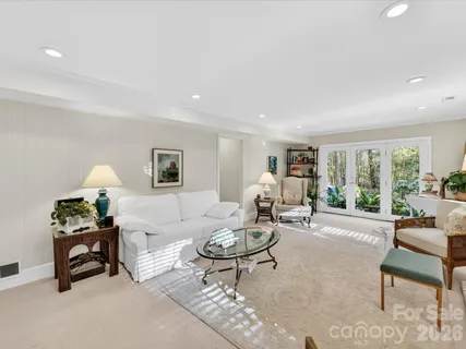 a living room with furniture and a table