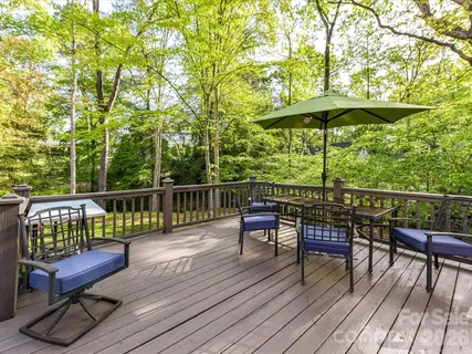 a view of sitting area with furniture on wooden deck