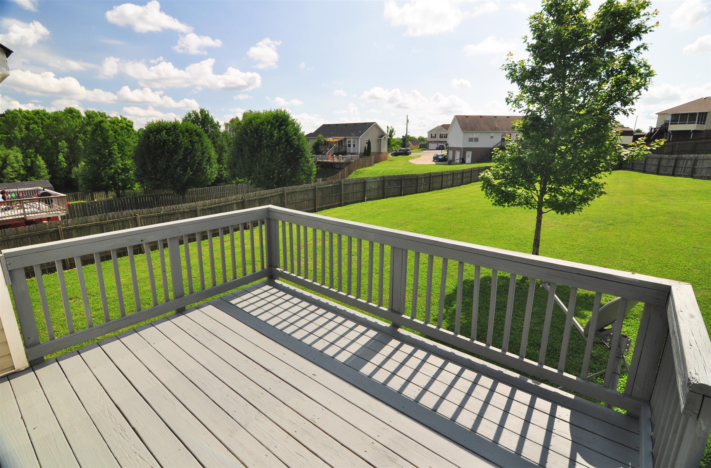 Freshly Painted Deck that overlooks a Massive Yard!
