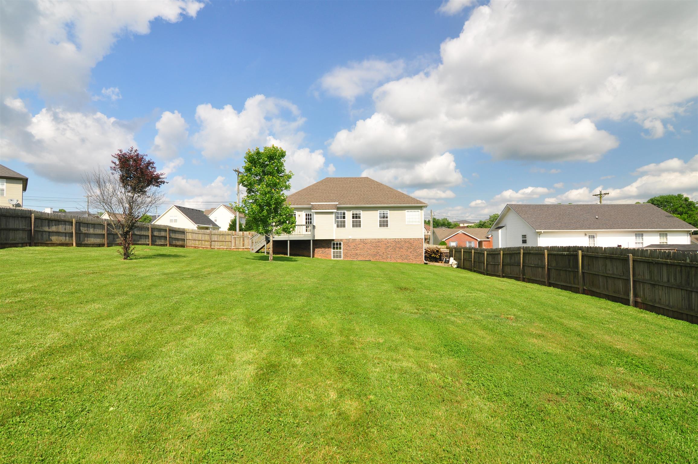 Real View of Yard Complete with Privacy Fence