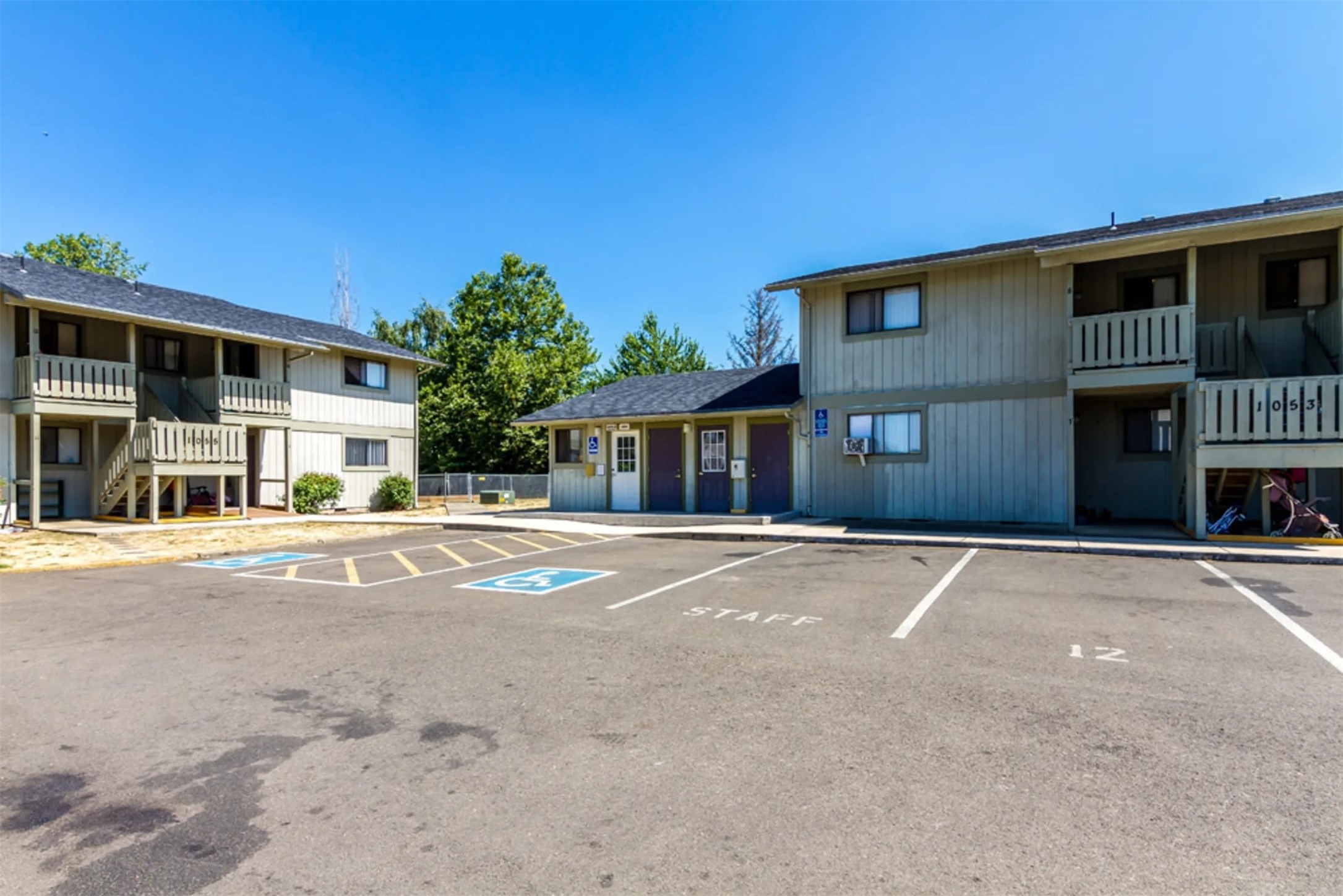 1051 East Central Avenue Sutherlin, OR 97479 - Photo 3 of 9 a front view of a house with a yard and garage