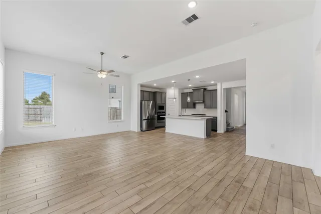 a view of kitchen with wooden floor and window