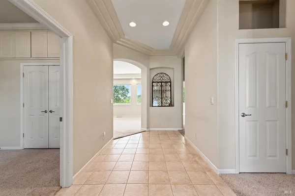 a view of a entryway door with hallway
