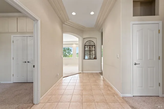a view of a entryway door with hallway