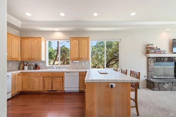 a kitchen with sink and cabinets