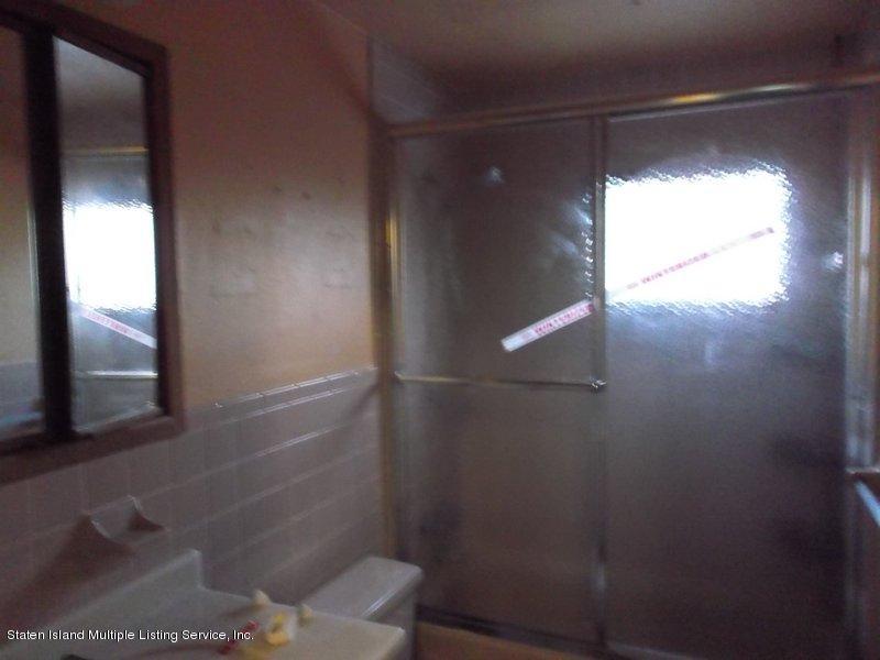 1 Sarno Street Colonia, NJ 07067 - Photo 15 of 30 a bathroom with a glass shower door
