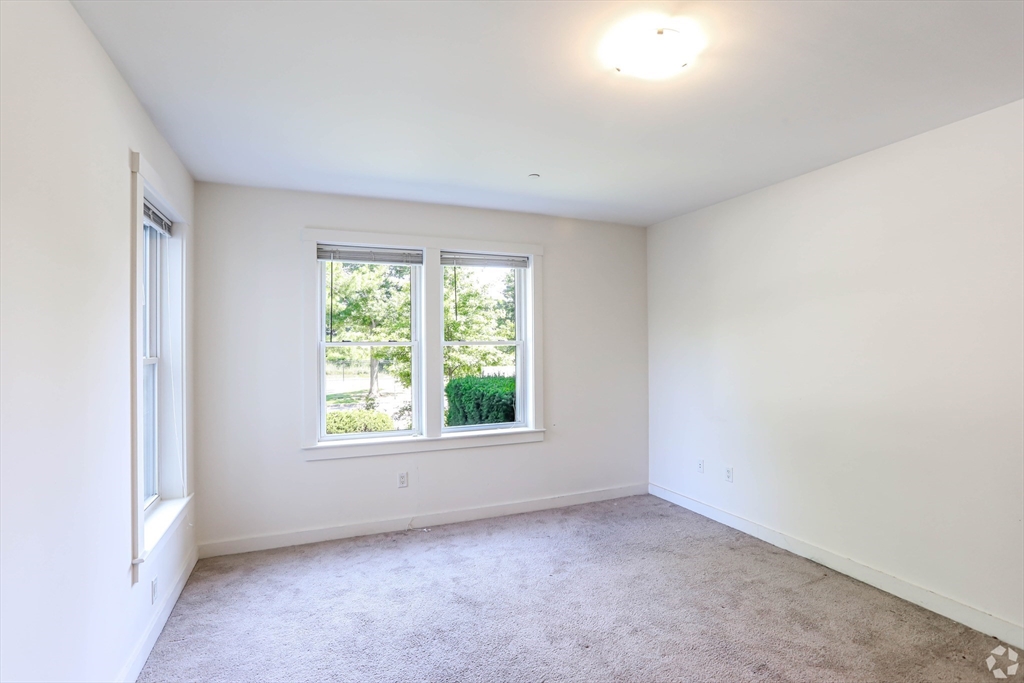 87 New Street, Unit 412 Cambridge, MA 02138 - Photo 4 of 9 an empty room with a window