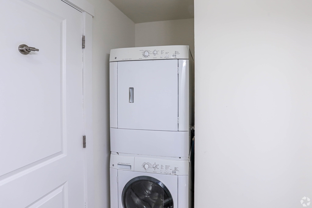 87 New Street, Unit 412 Cambridge, MA 02138 - Photo 6 of 9 a utility room with dryer and washer