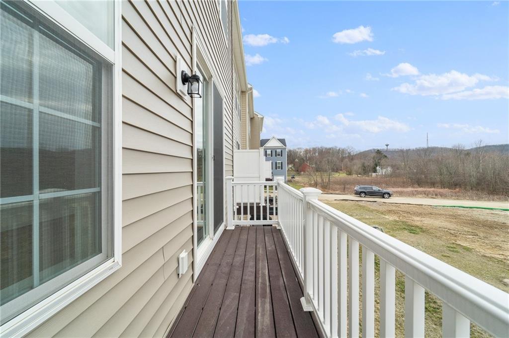 113 Affinity Drive Harmony, PA 16037 - Photo 20 of 40 a view of a balcony with wooden floor and fence