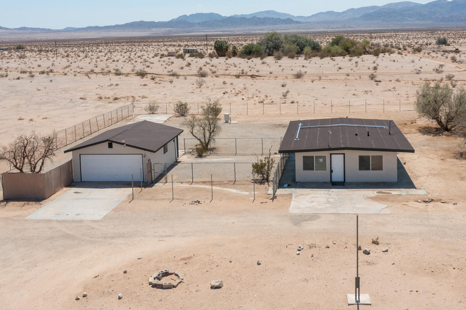 84417 Amboy Road Twentynine Palms, CA 92277 - Photo 1 of 23 an aerial view of houses with wooden fence
