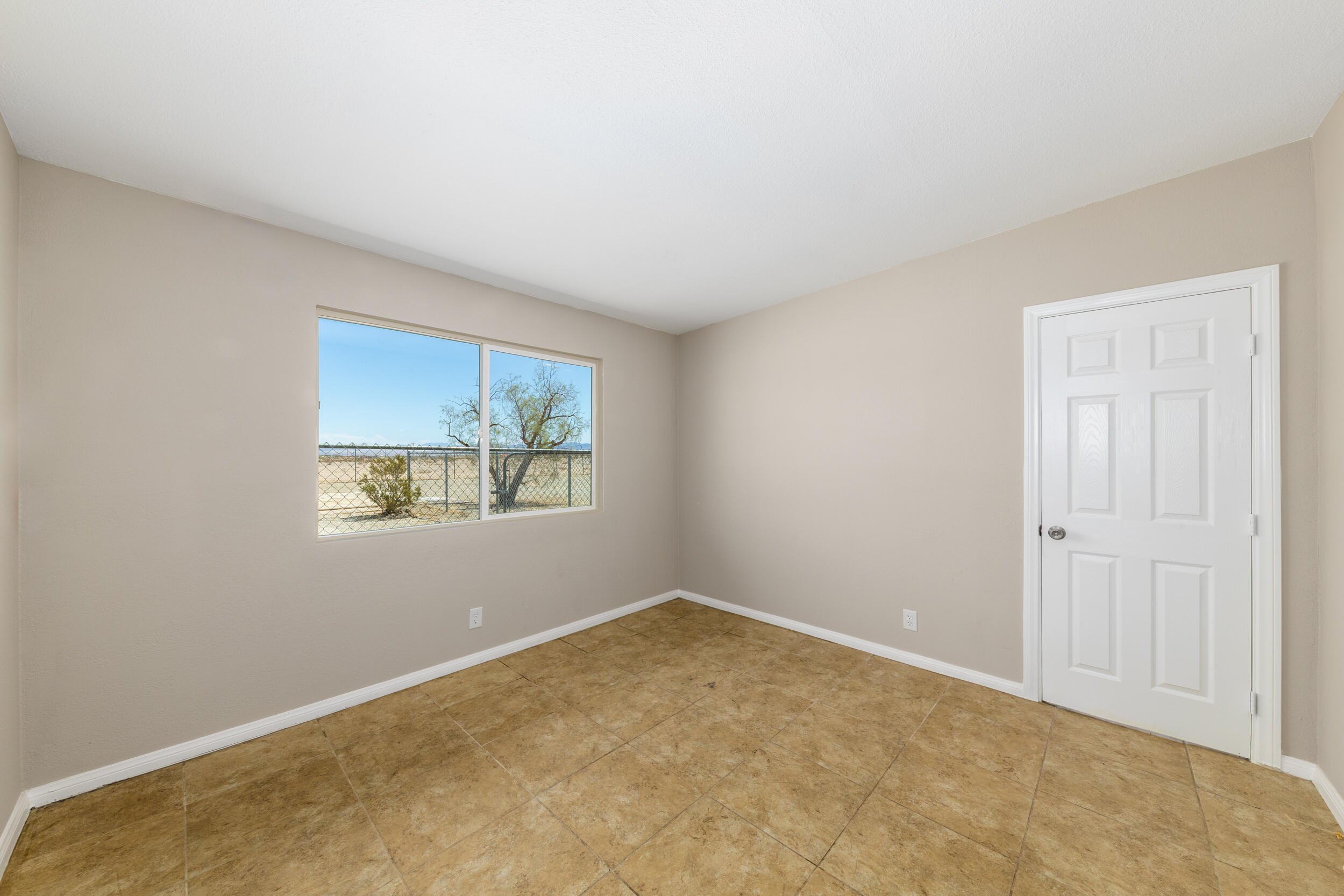 84417 Amboy Road Twentynine Palms, CA 92277 - Photo 9 of 23 an empty room with windows