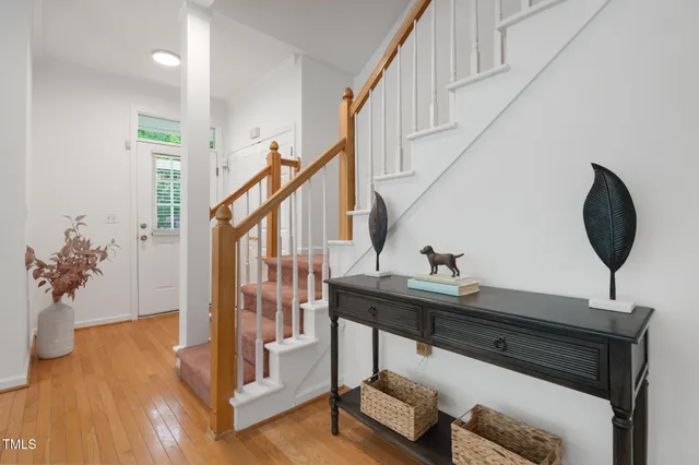 a view of entryway with wooden floor and a potted plant