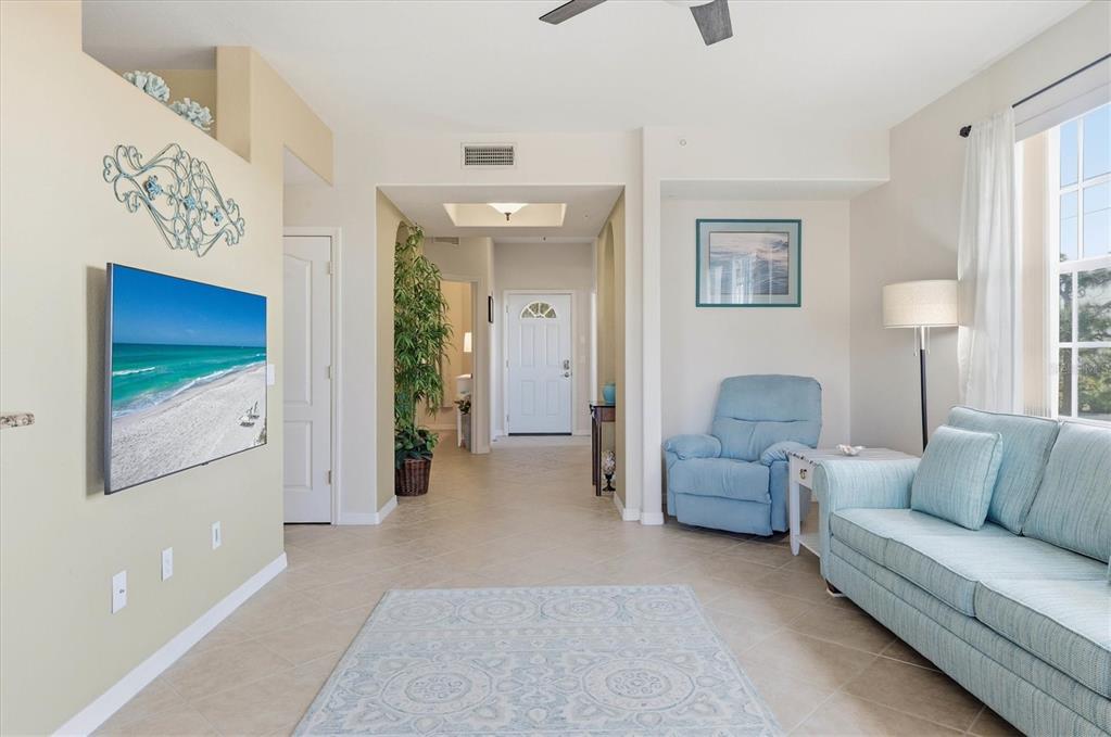 980 Cooper Street, Unit 201 Venice, FL 34285 - Photo 12 of 87 a living room with furniture and a couch